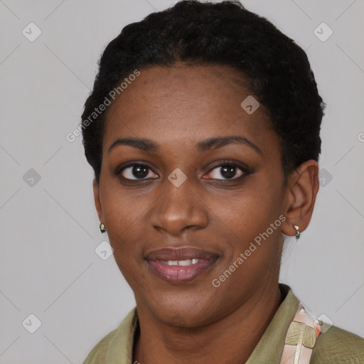 Joyful black young-adult female with short  black hair and brown eyes