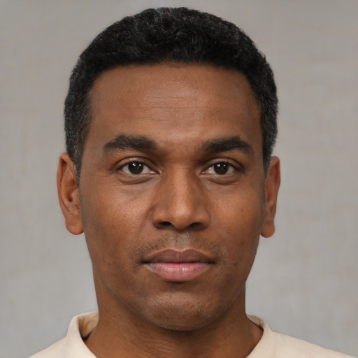 Neutral black young-adult male with short  black hair and brown eyes