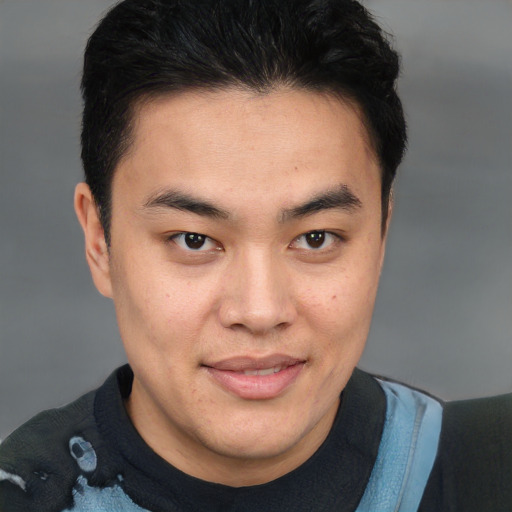 Joyful latino young-adult male with short  brown hair and brown eyes