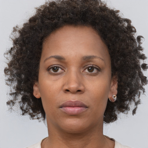 Neutral black adult female with short  brown hair and brown eyes