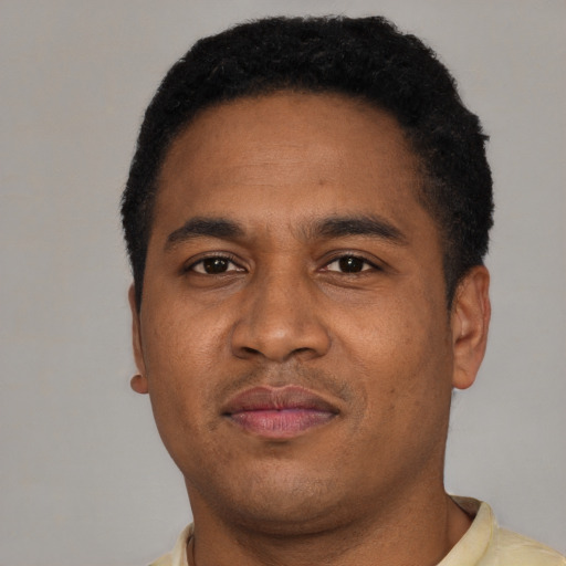 Neutral latino adult male with short  brown hair and brown eyes