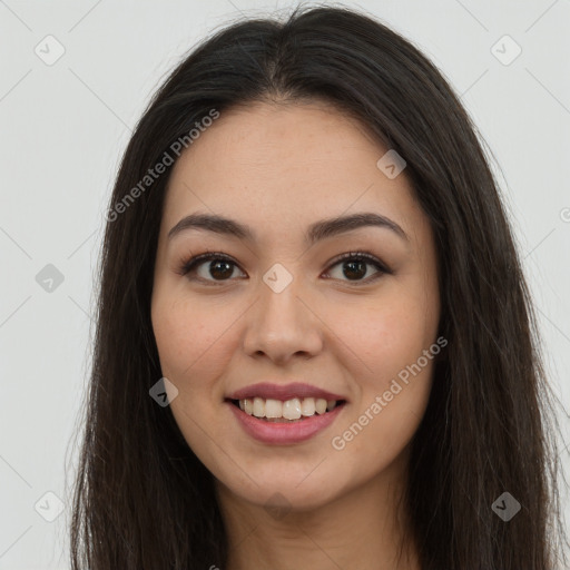 Joyful asian young-adult female with long  brown hair and brown eyes