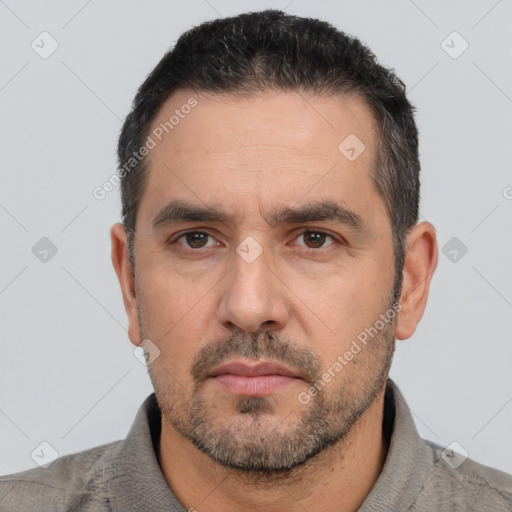 Neutral white adult male with short  black hair and brown eyes