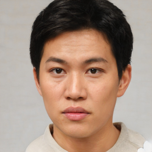 Neutral asian young-adult male with short  black hair and brown eyes