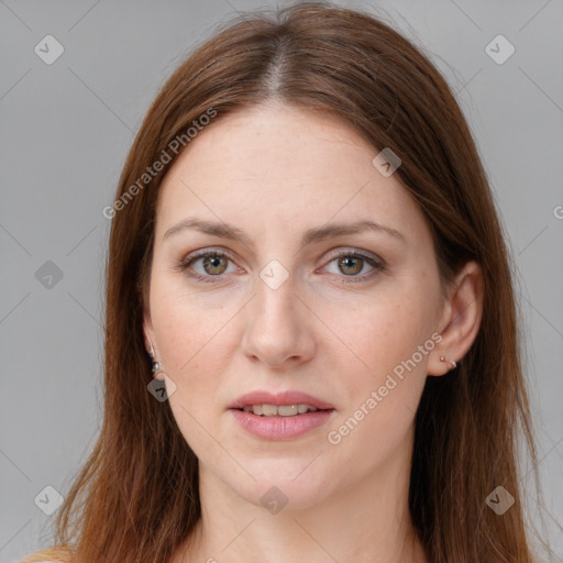 Joyful white young-adult female with long  brown hair and blue eyes