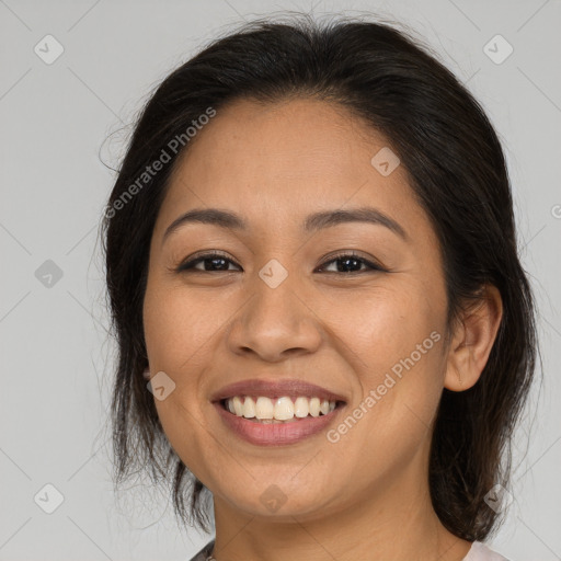 Joyful latino young-adult female with medium  brown hair and brown eyes