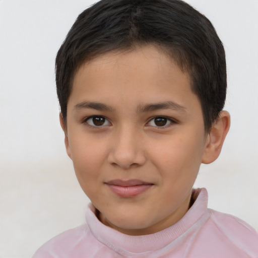 Joyful latino child female with short  brown hair and brown eyes