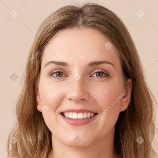 Joyful white young-adult female with long  brown hair and grey eyes