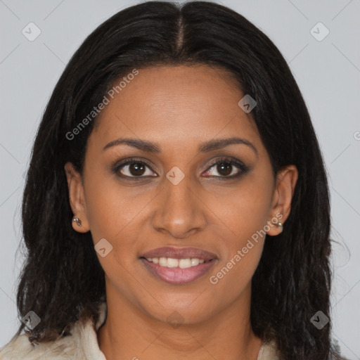 Joyful black young-adult female with long  brown hair and brown eyes