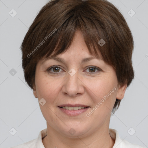 Joyful white adult female with short  brown hair and brown eyes