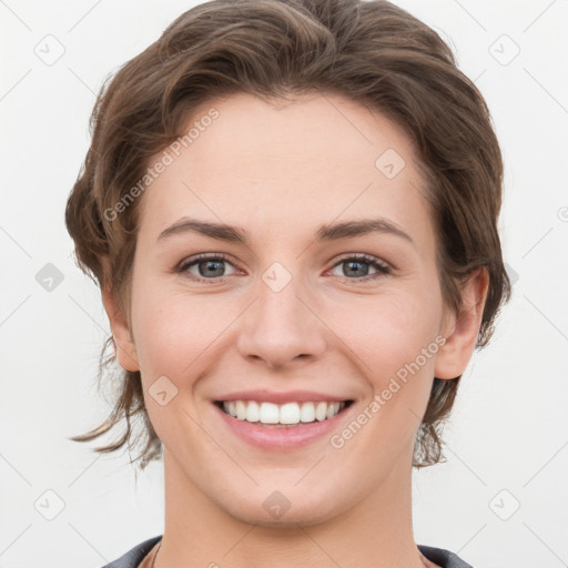 Joyful white young-adult female with medium  brown hair and grey eyes