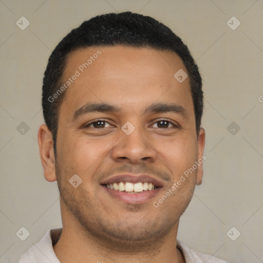 Joyful latino young-adult male with short  brown hair and brown eyes