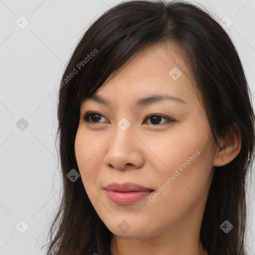 Joyful asian young-adult female with long  brown hair and brown eyes