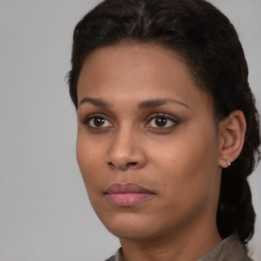 Neutral black young-adult female with short  brown hair and brown eyes