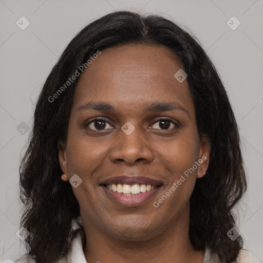 Joyful black young-adult female with medium  brown hair and brown eyes