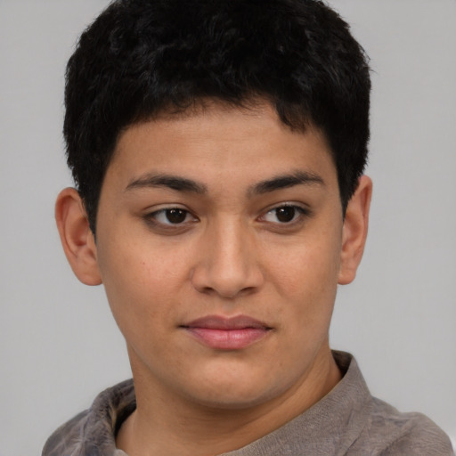 Joyful latino young-adult male with short  brown hair and brown eyes