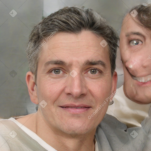 Joyful white adult male with short  brown hair and grey eyes