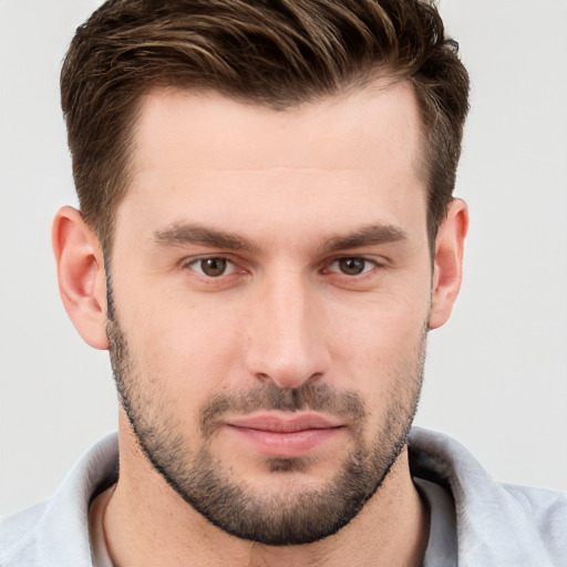 Joyful white young-adult male with short  brown hair and brown eyes