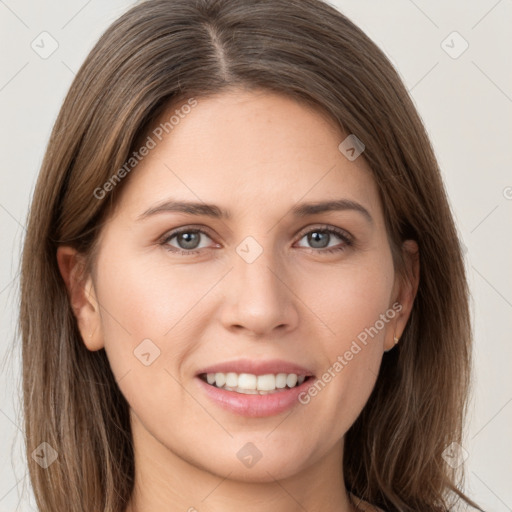 Joyful white young-adult female with long  brown hair and grey eyes