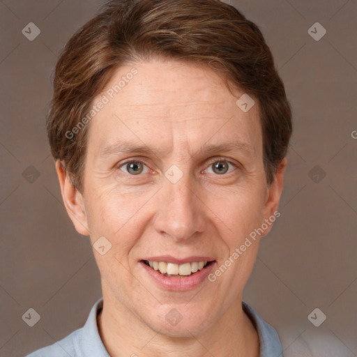 Joyful white adult male with short  brown hair and grey eyes