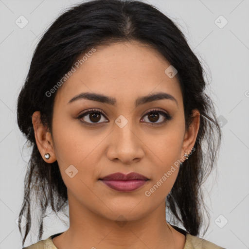 Joyful latino young-adult female with medium  brown hair and brown eyes