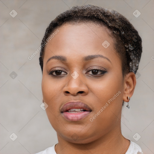 Joyful black young-adult female with short  brown hair and brown eyes