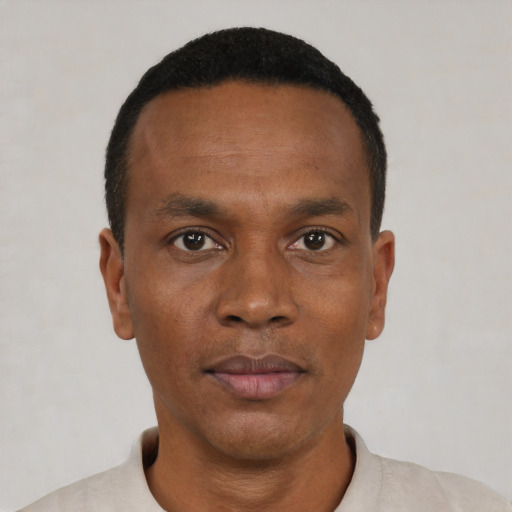 Neutral black young-adult male with short  black hair and brown eyes
