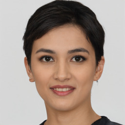 Joyful asian young-adult female with short  black hair and brown eyes