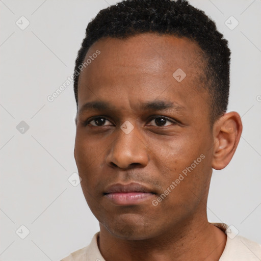 Neutral black young-adult male with short  black hair and brown eyes