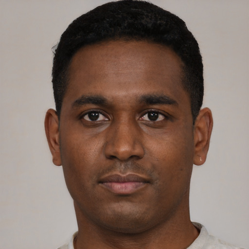 Neutral black young-adult male with short  black hair and brown eyes
