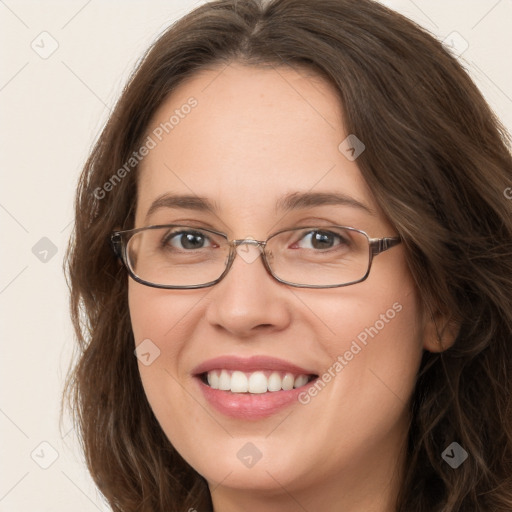 Joyful white young-adult female with long  brown hair and green eyes