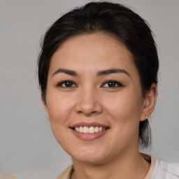 Joyful white young-adult female with medium  brown hair and brown eyes