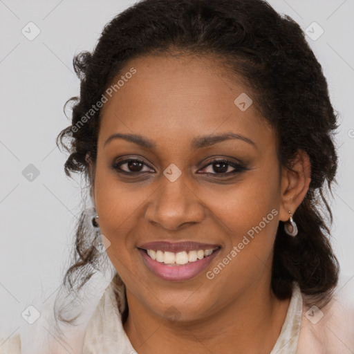 Joyful black young-adult female with long  brown hair and brown eyes