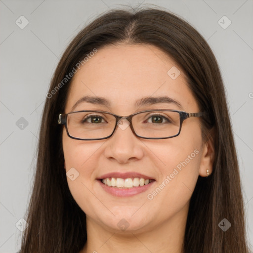 Joyful white young-adult female with long  brown hair and green eyes