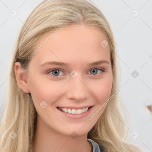 Joyful white young-adult female with long  blond hair and blue eyes