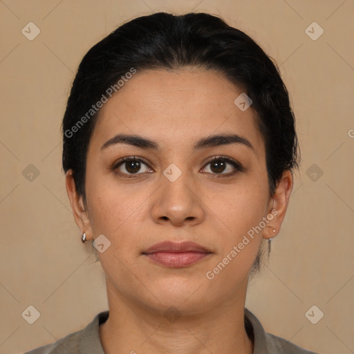 Joyful latino young-adult female with medium  brown hair and brown eyes