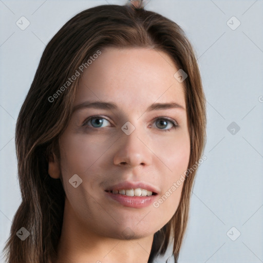 Joyful white young-adult female with long  brown hair and blue eyes