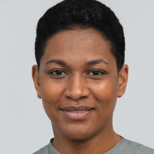 Joyful black young-adult female with short  black hair and brown eyes