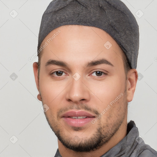 Joyful white young-adult male with short  black hair and brown eyes