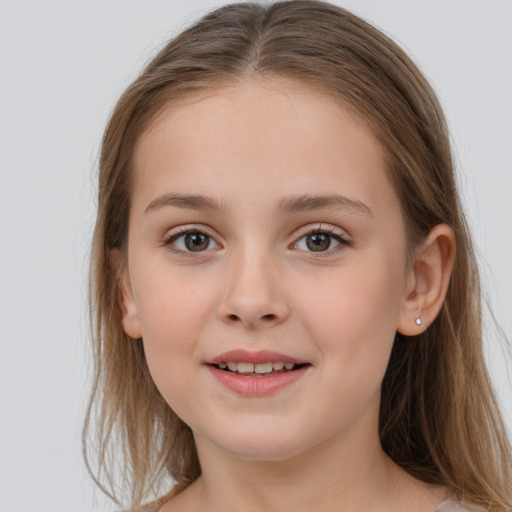 Joyful white child female with long  brown hair and grey eyes