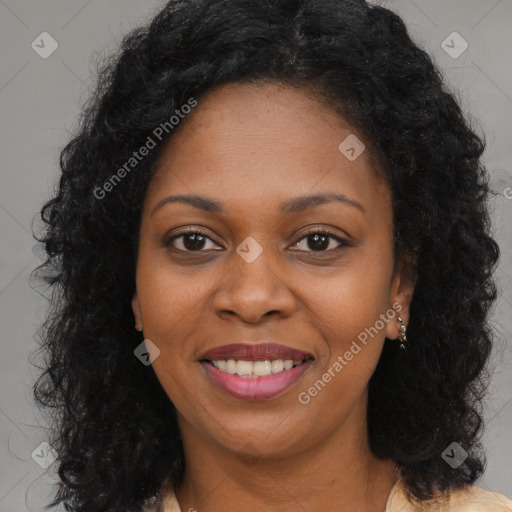 Joyful black young-adult female with long  brown hair and brown eyes