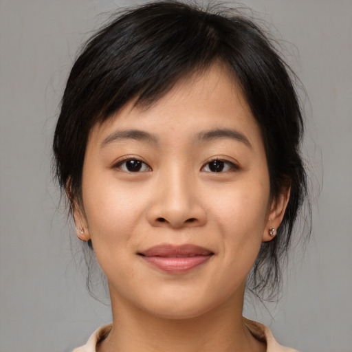 Joyful asian young-adult female with medium  brown hair and brown eyes