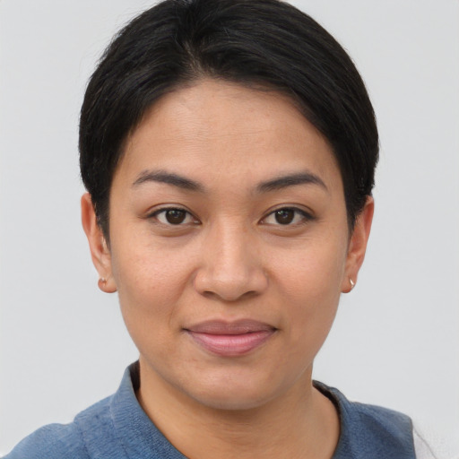 Joyful asian young-adult female with short  brown hair and brown eyes