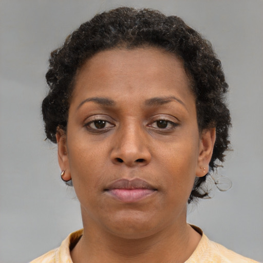 Neutral black young-adult female with short  brown hair and brown eyes