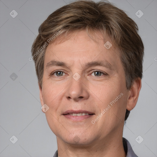 Joyful white adult male with short  brown hair and grey eyes