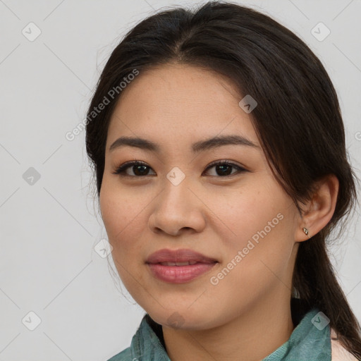 Joyful asian young-adult female with medium  brown hair and brown eyes