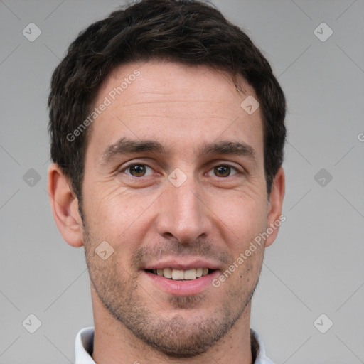 Joyful white young-adult male with short  brown hair and brown eyes