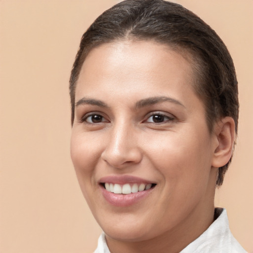 Joyful white young-adult female with short  brown hair and brown eyes