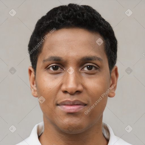 Joyful black young-adult male with short  black hair and brown eyes