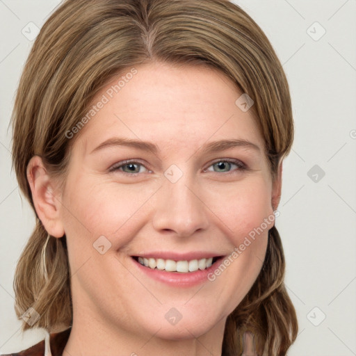 Joyful white young-adult female with long  brown hair and blue eyes